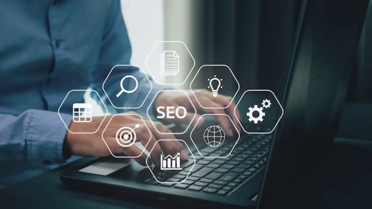 Person working on laptop with SEO icons representing search, analytics, and digital marketing strategies.